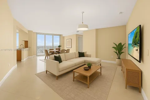 a view of a dining room with furniture and a potted plant