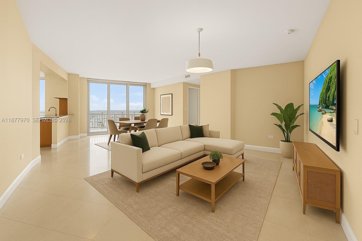848 Brickell Key Drive, Unit 2502 Miami, FL 33131 - Photo 16 of 40 a living room with furniture and a flat screen tv