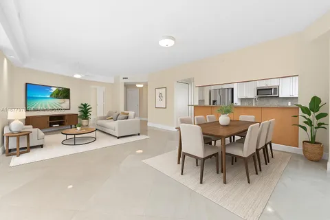 a kitchen with stainless steel appliances granite countertop a refrigerator sink and stove