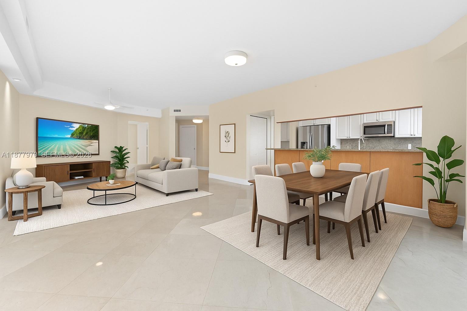 848 Brickell Key Drive, Unit 2502 Miami, FL 33131 - Photo 17 of 40 a view of a dining room with furniture and a potted plant