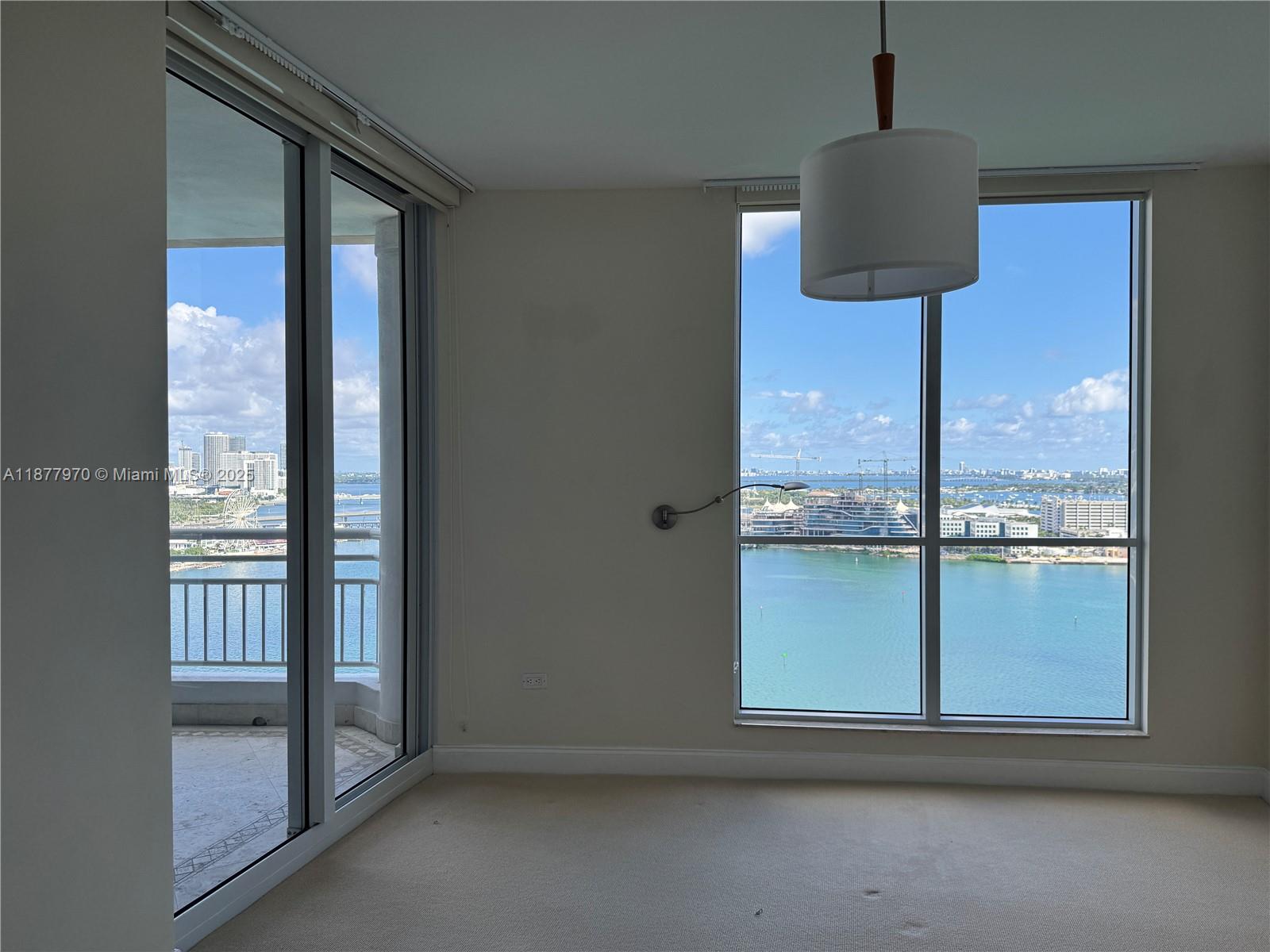 848 Brickell Key Drive, Unit 2502 Miami, FL 33131 - Photo 20 of 40 an empty room with a window