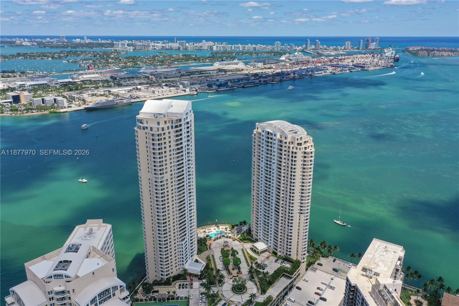 848 Brickell Key Drive, Unit 2502 Miami, FL 33131 - Photo 2 of 40 a view of a balcony with table and chairs