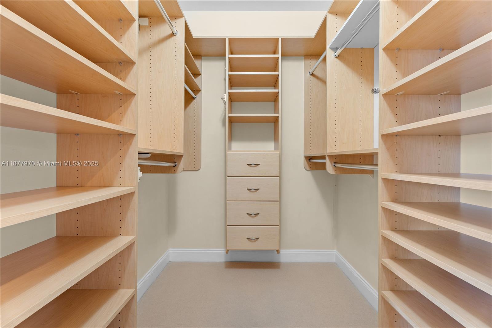 848 Brickell Key Drive, Unit 2502 Miami, FL 33131 - Photo 22 of 40 a view of walk in closet with empty racks