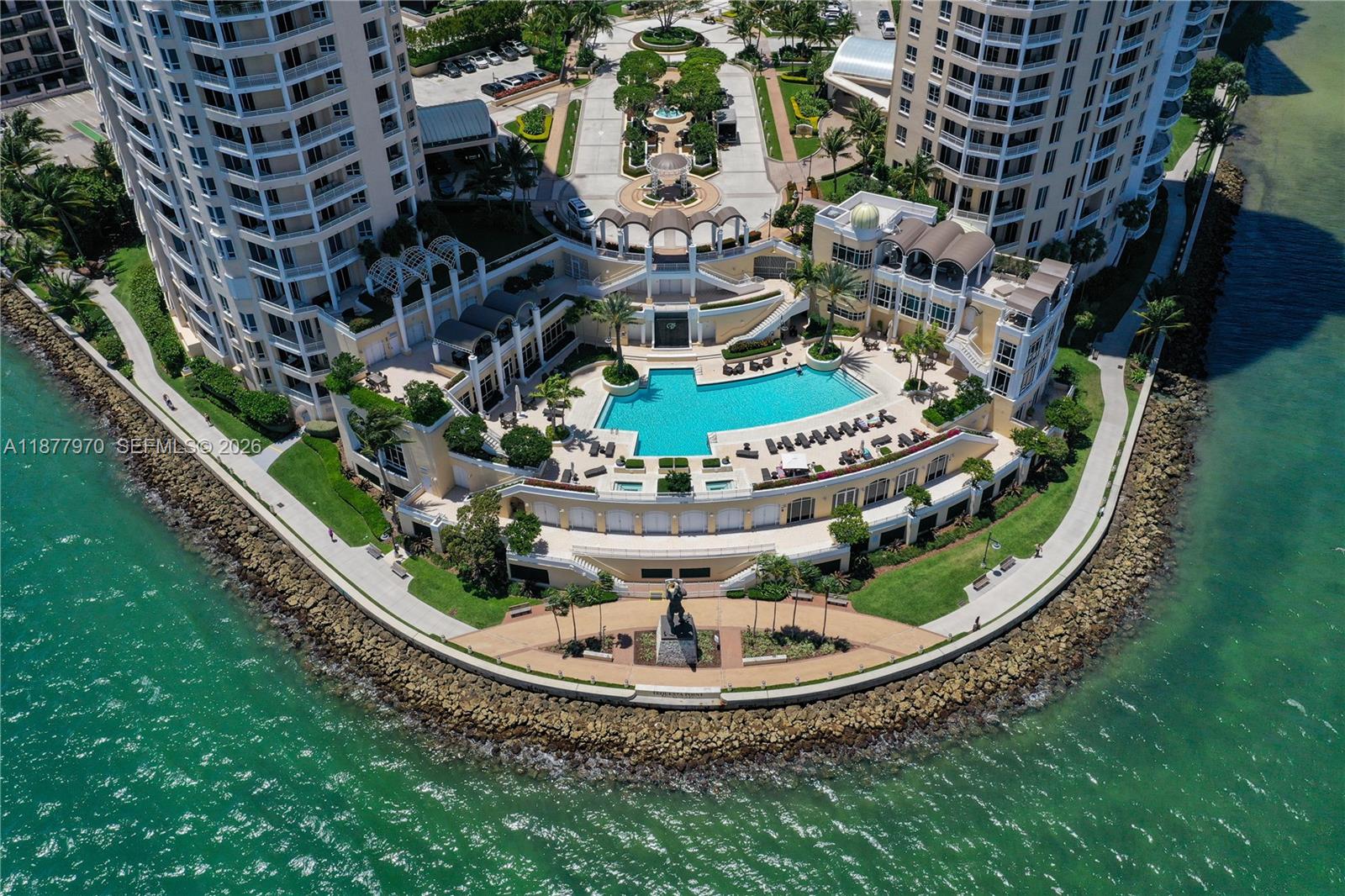 848 Brickell Key Drive, Unit 2502 Miami, FL 33131 - Photo 29 of 40 a view of a swimming pool with a garden