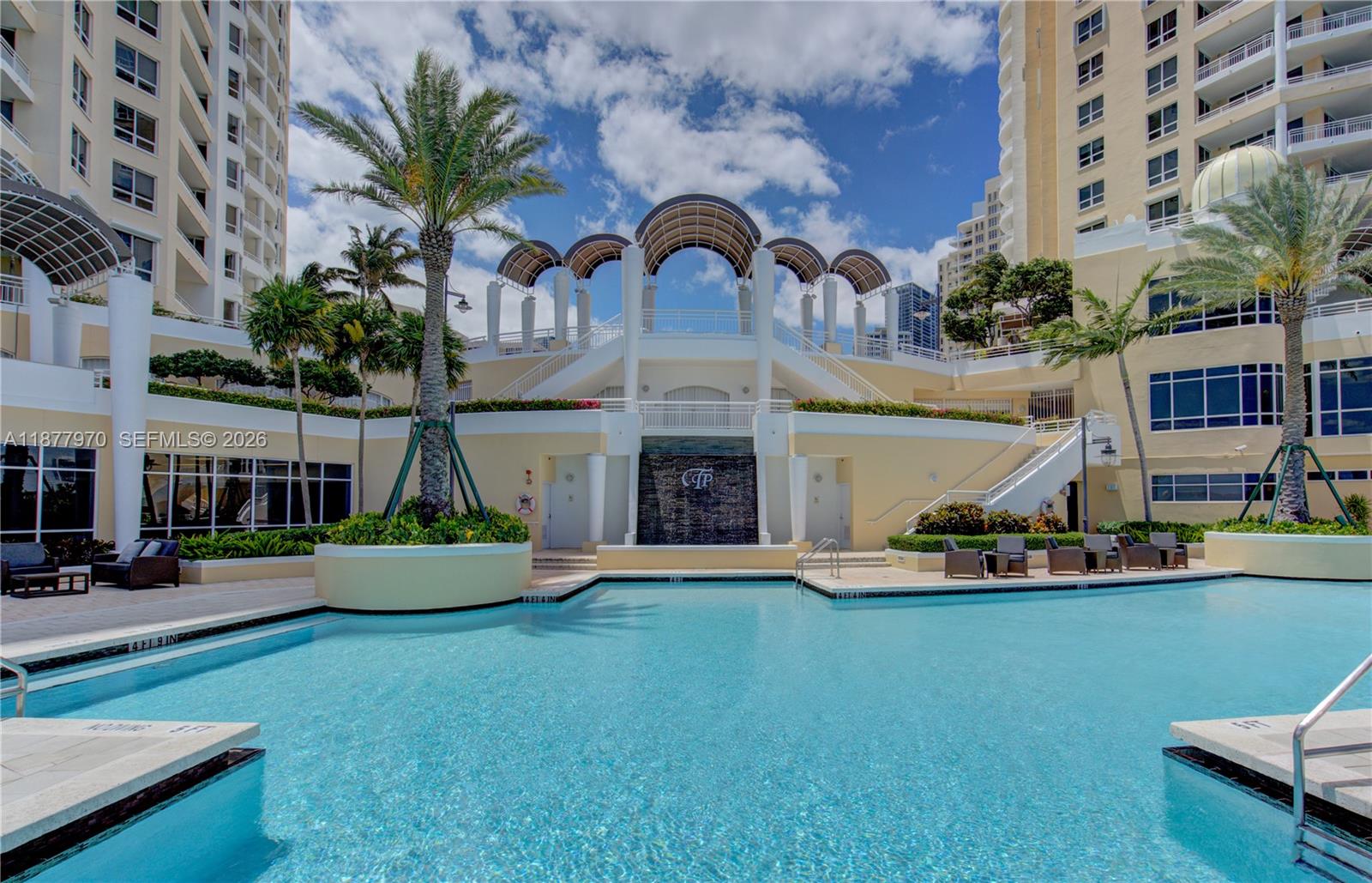 848 Brickell Key Drive, Unit 2502 Miami, FL 33131 - Photo 31 of 40 a front view of a house with garden and swimming pool