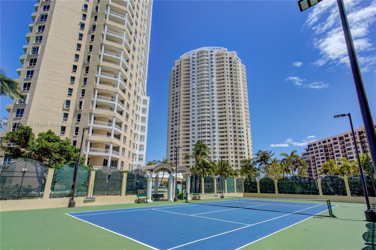 848 Brickell Key Drive, Unit 2502 Miami, FL 33131 - Photo 32 of 40 a view of a tall building next to a yard