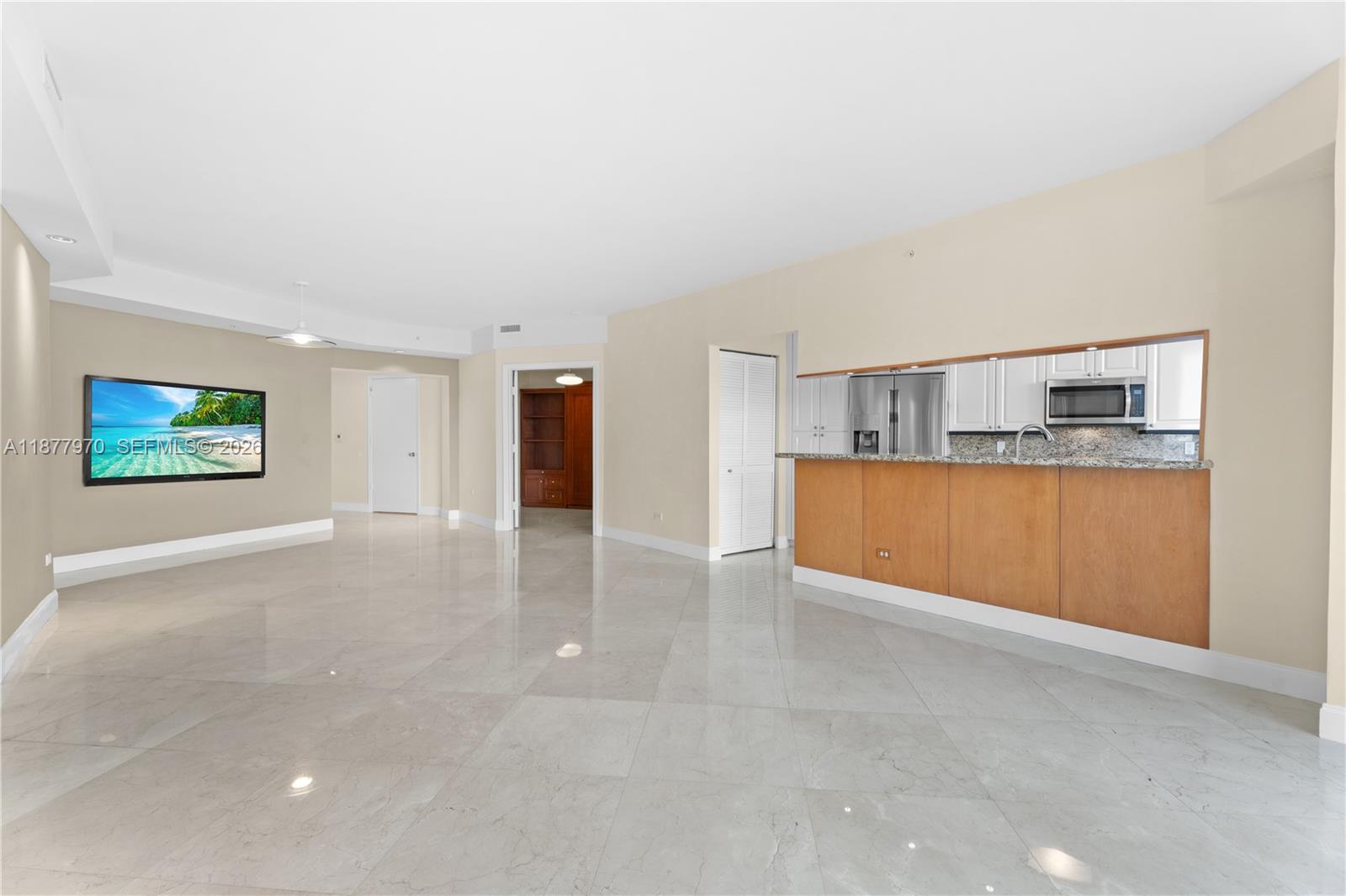 848 Brickell Key Drive, Unit 2502 Miami, FL 33131 - Photo 9 of 40 a view of a kitchen with a sink and a cabinet