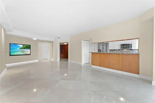 a view of a kitchen with a sink and a cabinet