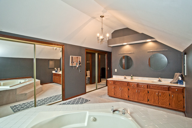 1936 Slippery Rock Road Naperville, IL 60565 - Photo 14 of 25 a room with a bed and a mirror on the wall