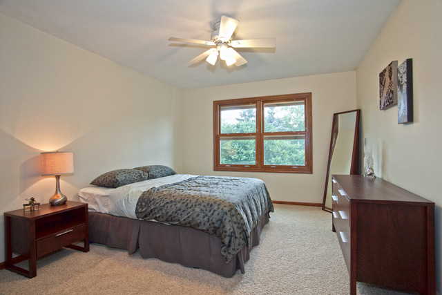 1936 Slippery Rock Road Naperville, IL 60565 - Photo 18 of 25 a bedroom with a bed and a window
