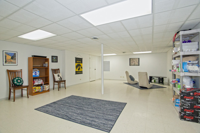 1936 Slippery Rock Road Naperville, IL 60565 - Photo 21 of 25 a living room with furniture and a flat screen tv