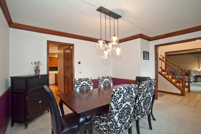 1936 Slippery Rock Road Naperville, IL 60565 - Photo 3 of 25 a view of a dining room with furniture and chandelier