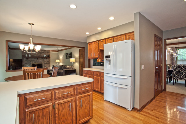 1936 Slippery Rock Road Naperville, IL 60565 - Photo 7 of 25 a kitchen with stainless steel appliances kitchen island granite countertop a refrigerator and a sink