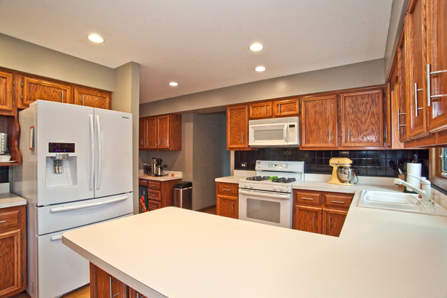 1936 Slippery Rock Road Naperville, IL 60565 - Photo 8 of 25 a kitchen with stainless steel appliances granite countertop a refrigerator sink stove and large window