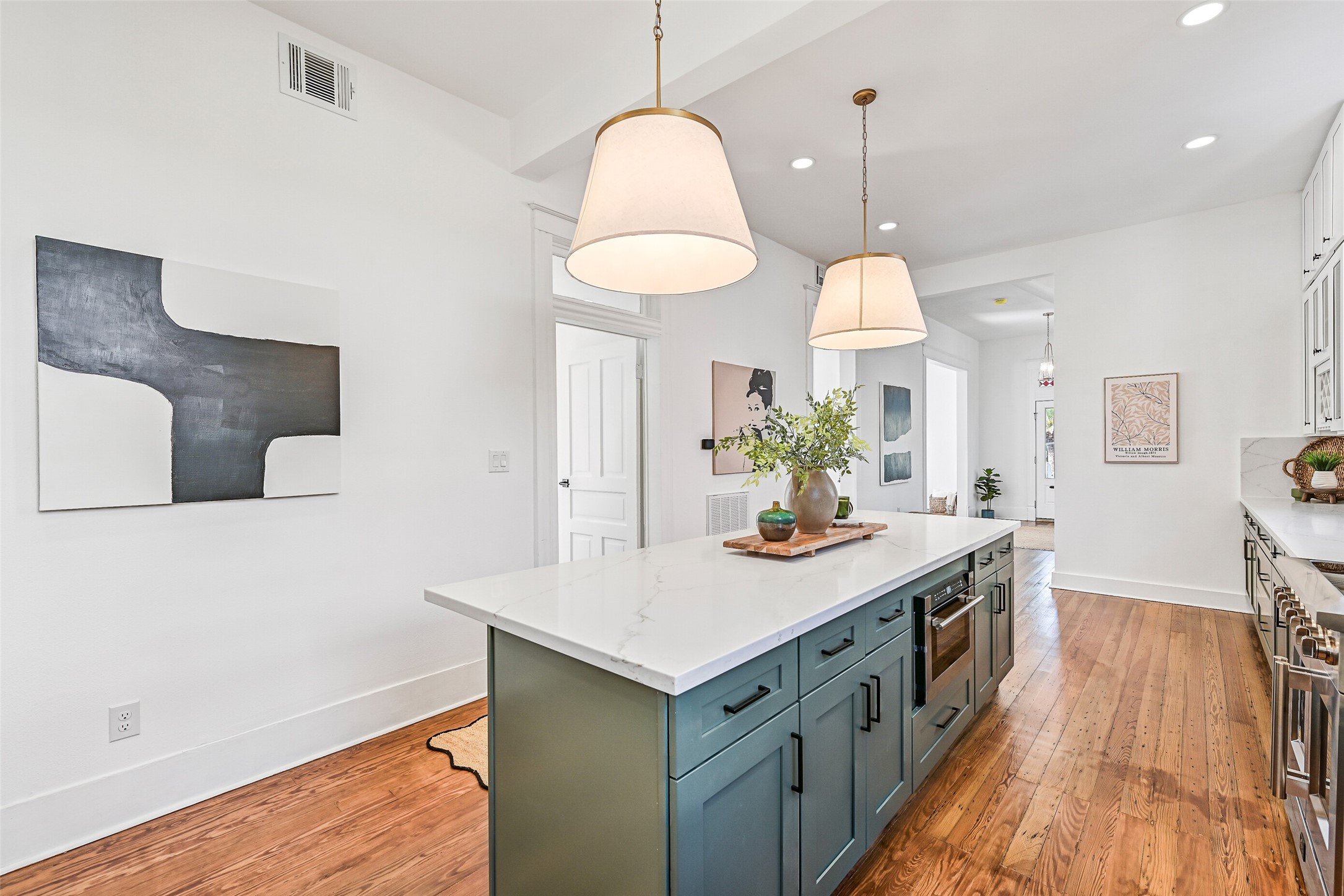 2010 Rosenberg Street Galveston, TX 77550 - Photo 19 of 50 This perspective shows the perfect balance of form and function. The flow between kitchen, dining, and living areas makes entertaining a breeze, whether hosting a crowd or enjoying a quiet night in. Fresh AC keeps the air comfortable, and every thoughtful detail ensures you’re always at the center of the home’s warmth and energy.
