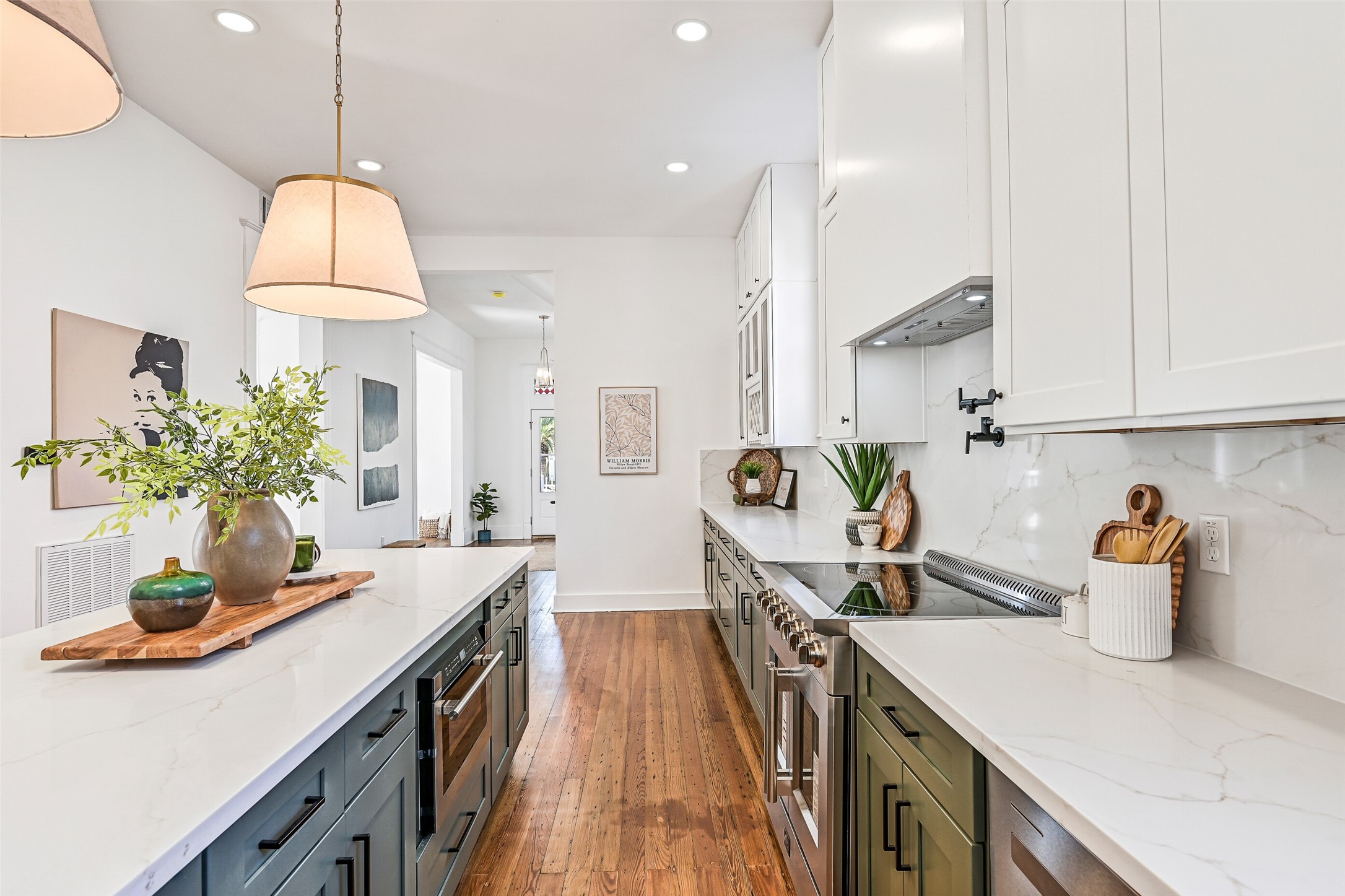 2010 Rosenberg Street Galveston, TX 77550 - Photo 20 of 50 A closer view reveals how beautifully this kitchen lives — open, efficient, and welcoming. Soft-close cabinets, abundant countertops, and thoughtful storage keep everything at your fingertips while letting you stay part of every conversation. Family breakfasts, casual dinners, or gatherings with friends and wine — this space turns every meal into an occasion.