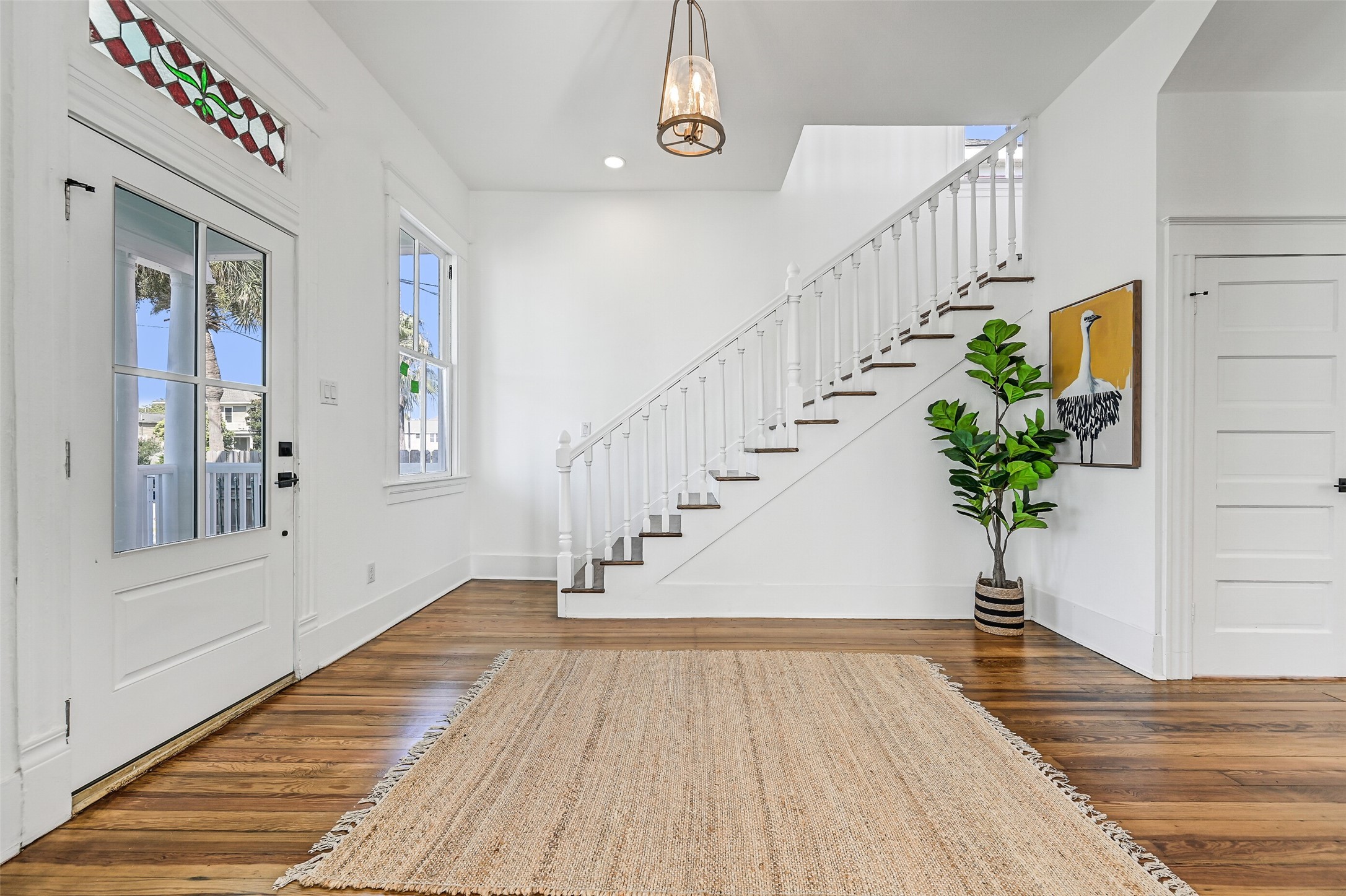 2010 Rosenberg Street Galveston, TX 77550 - Photo 21 of 50 Step inside and feel the charm! The bright, open foyer greets you with warmth and character, offering a beautiful first impression that sets the tone for the entire home. Fresh paint and natural light enhance every corner, while the nearby first-floor half bath adds convenience. From the moment you enter, you can sense the love and energy that fills these walls — a space that feels instantly inviting and ready to embrace you.
