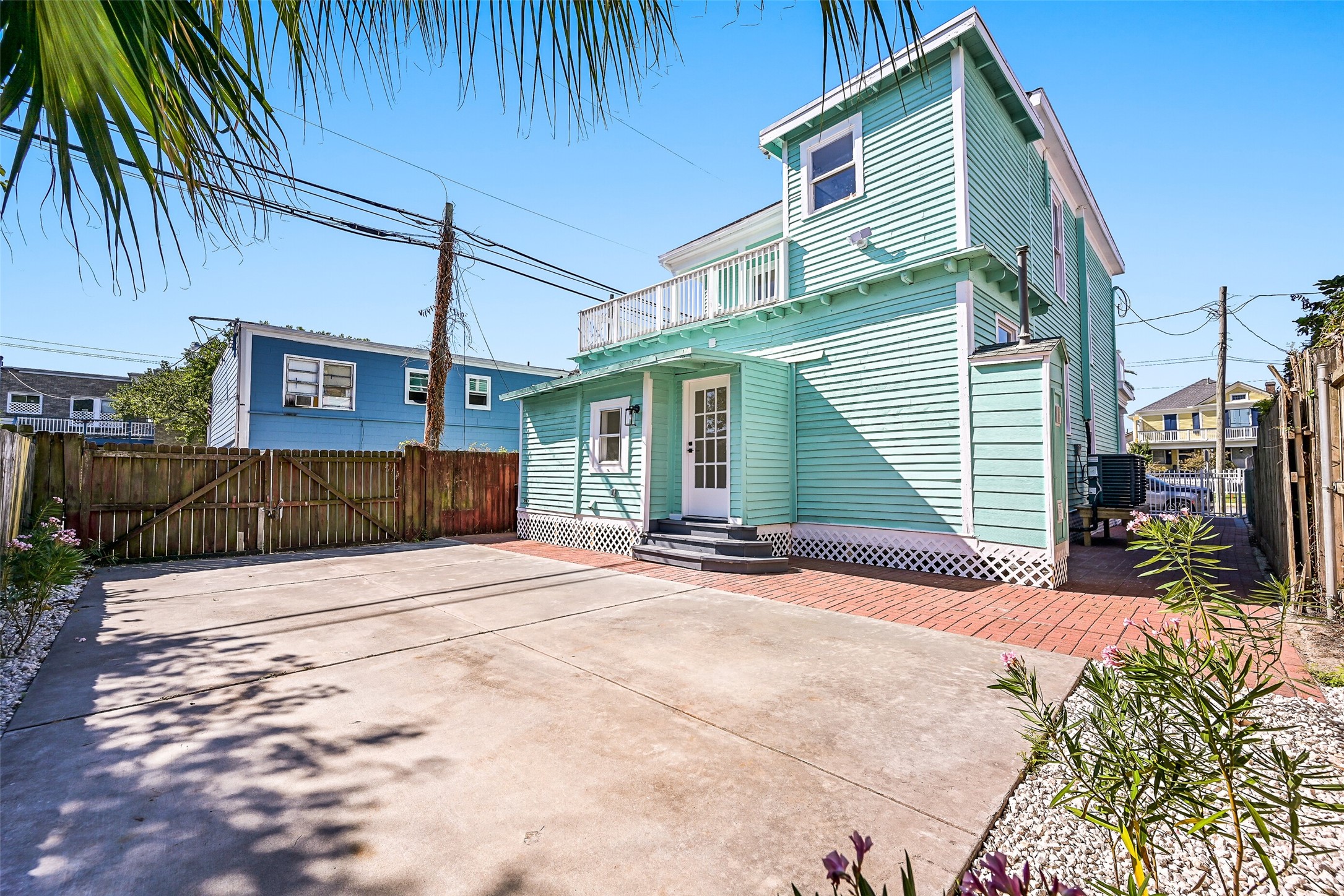 2010 Rosenberg Street Galveston, TX 77550 - Photo 42 of 50 From this view, the terrace above and easy access to the laundry and kitchen make this backyard the heart of effortless coastal living! Imagine stepping out for morning coffee, hosting weekend cookouts, or watching the sunset from the terrace above. The fully fenced yard offers privacy and plenty of room to relax, play, or entertain — a perfect extension of your island lifestyle!
