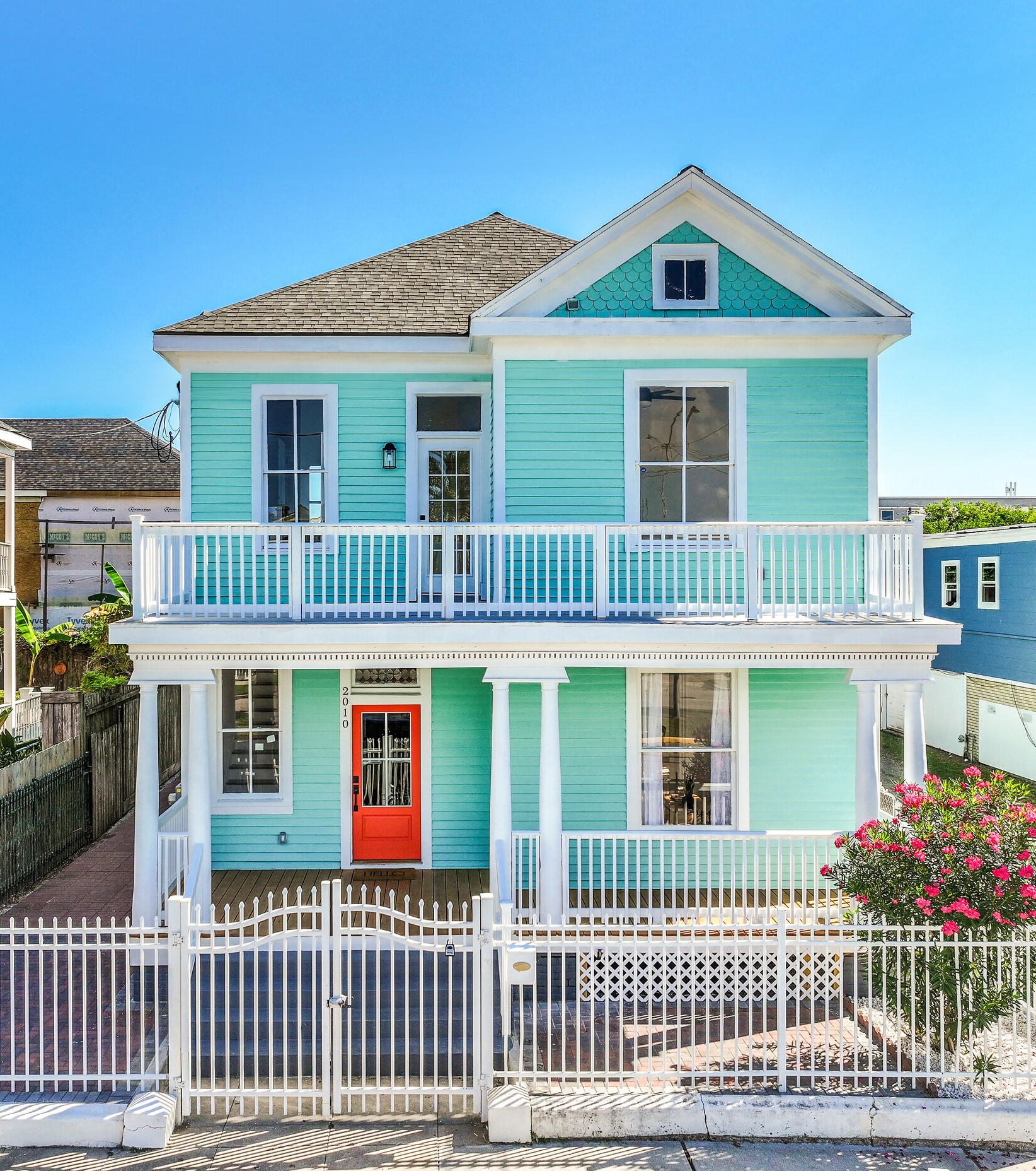 2010 Rosenberg Street Galveston, TX 77550 - Photo 49 of 50 Welcome to 2010 Rosenberg — ONE BLOCK FROM THE BEACH and the ICONIC Pleasure Pier! This fully remodeled two-story beauty blends historic charm with fresh sophistication. From the new front door to the fully fenced yard and brick-paver hardscape, every inch was crafted for low-maintenance coastal living. Relax on the front porch or upper deck, perfect for catching Mardi Gras or Lone Star Rally parades! With new HVAC, electrical, and plumbing!