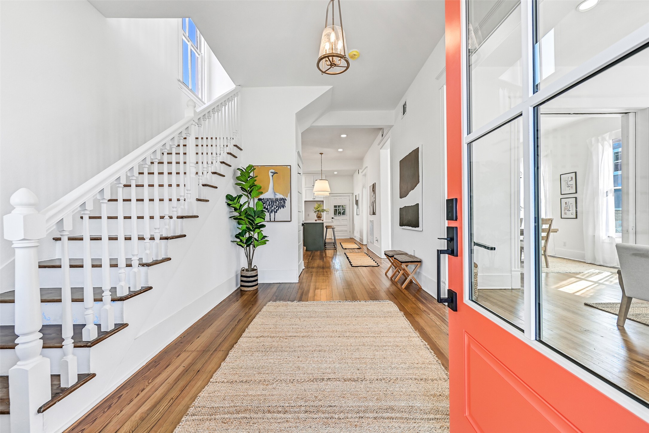 2010 Rosenberg Street Galveston, TX 77550 - Photo 6 of 50 Welcome home to the foyer — a space that blends comfort and elegance effortlessly! The open sightlines to the living and dining areas create a seamless flow, while the stairway adds architectural grace. With new paint and natural light enhancing the airy layout, every detail whispers you’re home. It’s the kind of entry that makes guests say “WOW” the second they step inside, and don’t forget the convenient first-floor half bath tucked nearby.