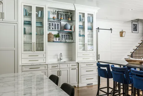 a bathroom with a tub a sink and mirror