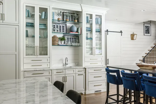 a bathroom with a tub a sink and mirror