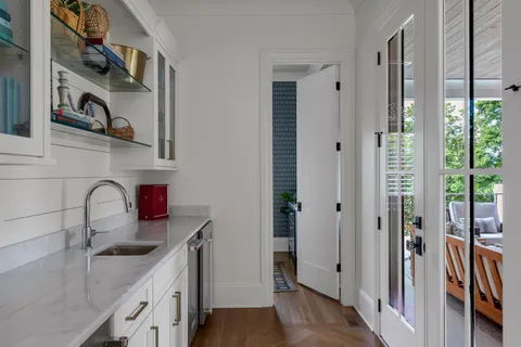 a bathroom with a toilet a sink and a large mirror