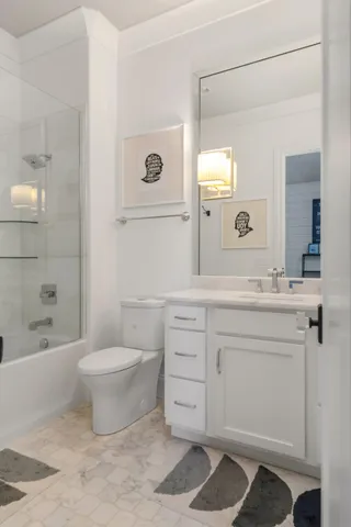 a bedroom with a bed and a flat tv screen