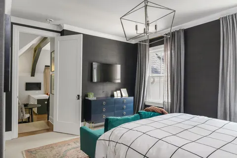 a front view of house with yard and outdoor seating