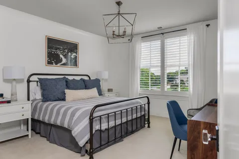 an aerial view of a house with garden space and patio