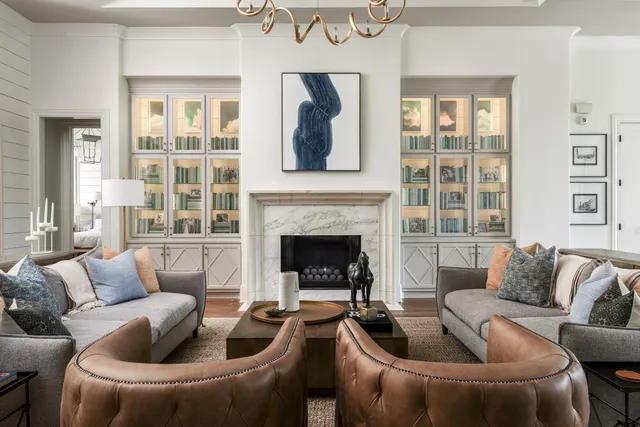 a view of living room with kitchen island furniture and flat screen tv