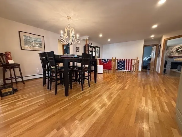 a view of an entryway with wooden floor