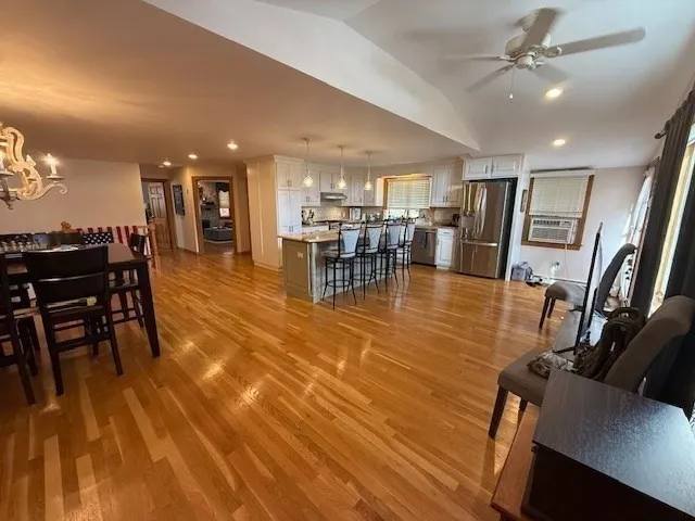 a view of a lobby with furniture and a kitchen