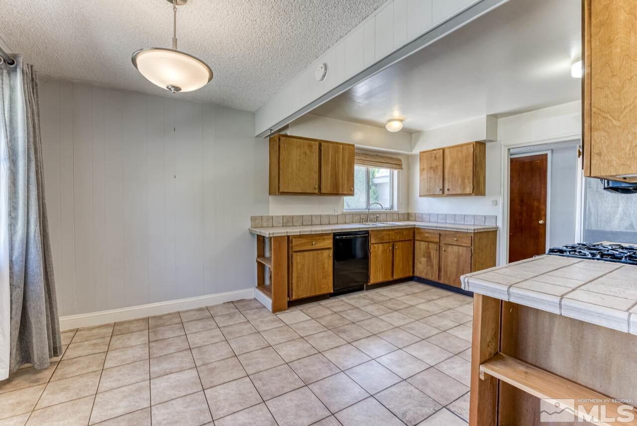 1850 Marlette Avenue Reno, NV 89503 - Photo 9 of 25 a kitchen with a sink cabinets and window