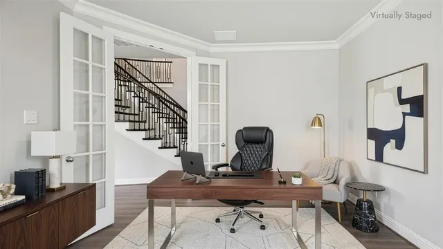 a view of staircase with railing and white walls