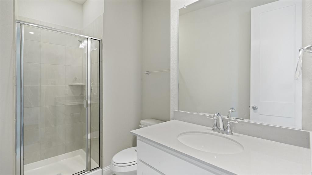 2805 Augustus Way Mansfield, TX 76063 - Photo 19 of 40 a bathroom with a sink toilet and shower