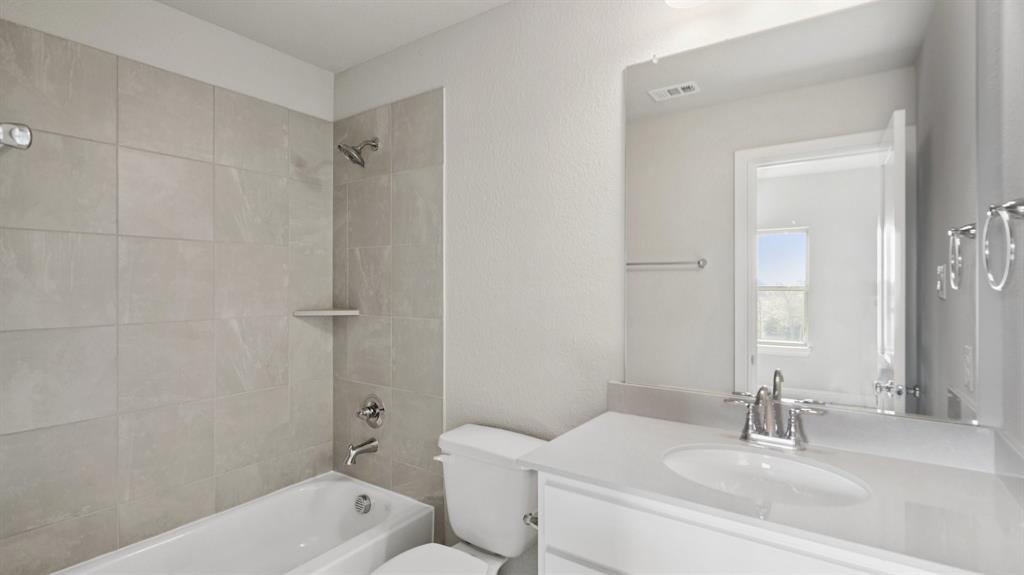 2805 Augustus Way Mansfield, TX 76063 - Photo 29 of 40 a bathroom with a sink a toilet and shower