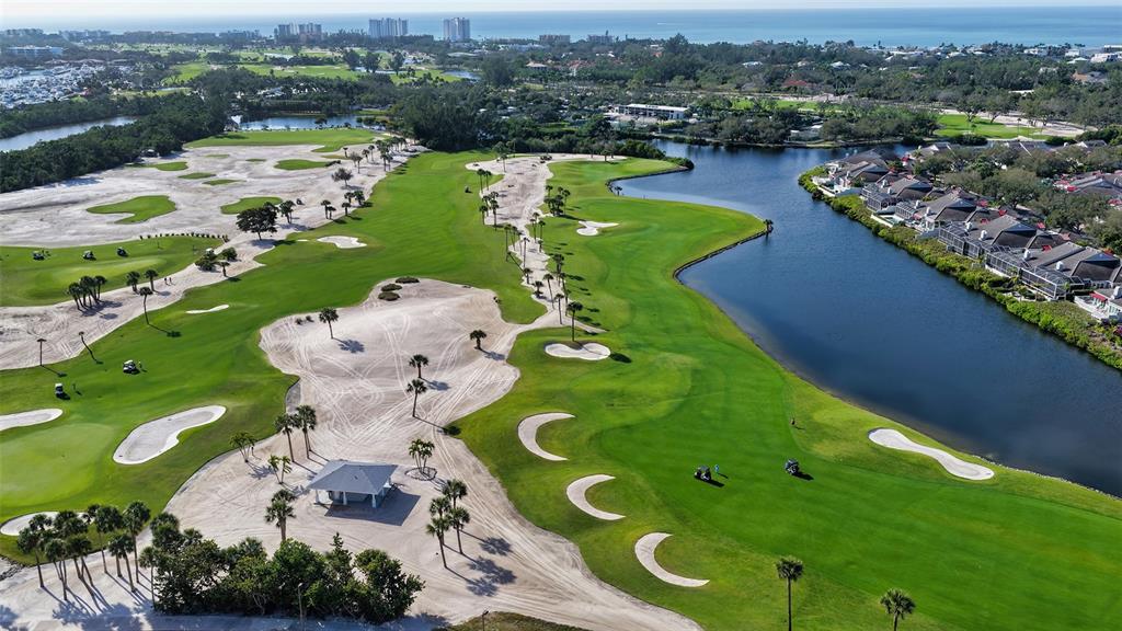 455 Longboat Club Road, Unit 402 Longboat Key, FL 34228 - Photo 46 of 48 an aerial view of a golf course with parking space