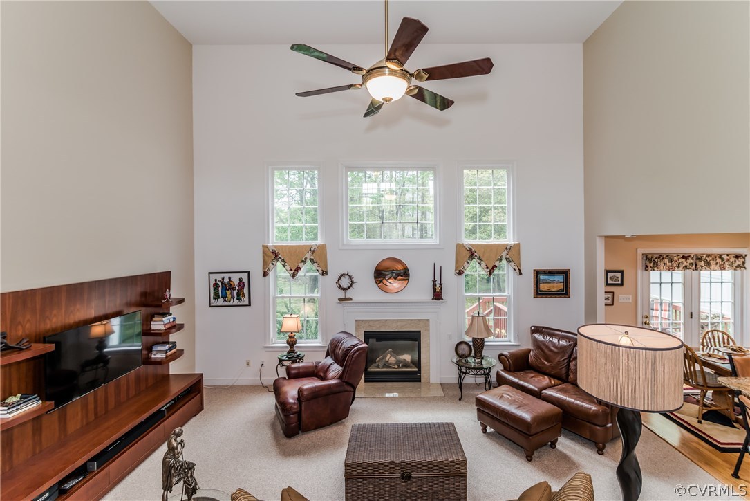 845 Club Ridge Court Chester, VA 23836 - Photo 24 of 37 a living room with furniture a fireplace and a large window