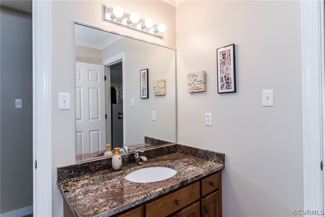 845 Club Ridge Court Chester, VA 23836 - Photo 36 of 37 a bathroom with a granite countertop sink and a mirror