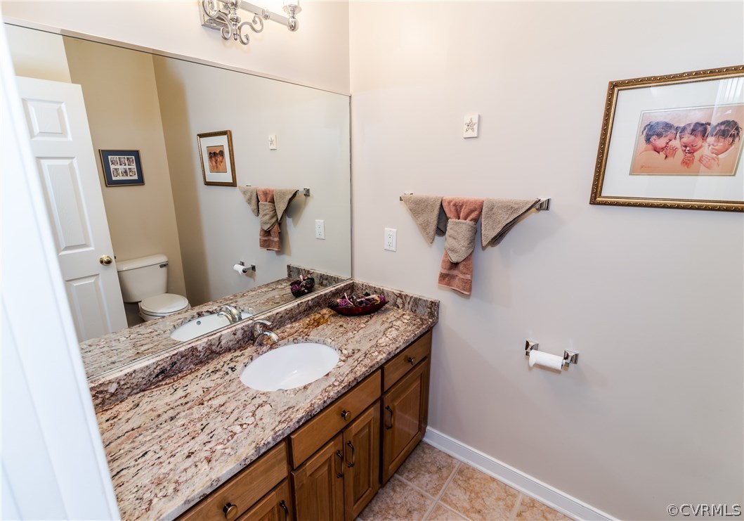845 Club Ridge Court Chester, VA 23836 - Photo 6 of 37 a bathroom with a granite countertop sink and a mirror