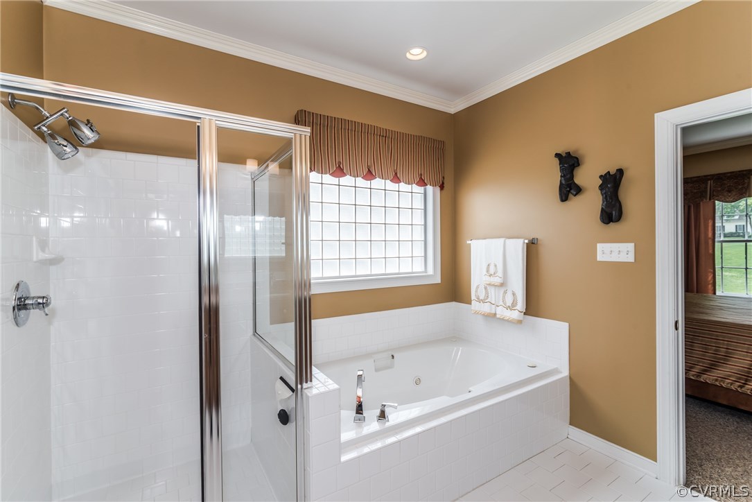 845 Club Ridge Court Chester, VA 23836 - Photo 9 of 37 a bathroom with a bathtub and a shower