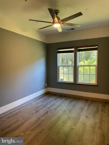 a kitchen with stainless steel appliances granite countertop a refrigerator and a stove