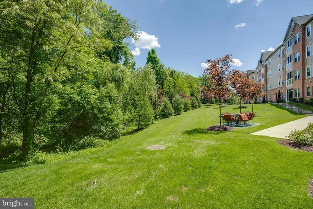 a view of a building next to a yard