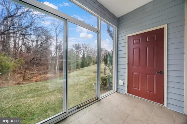 a view of a glass door and a yard