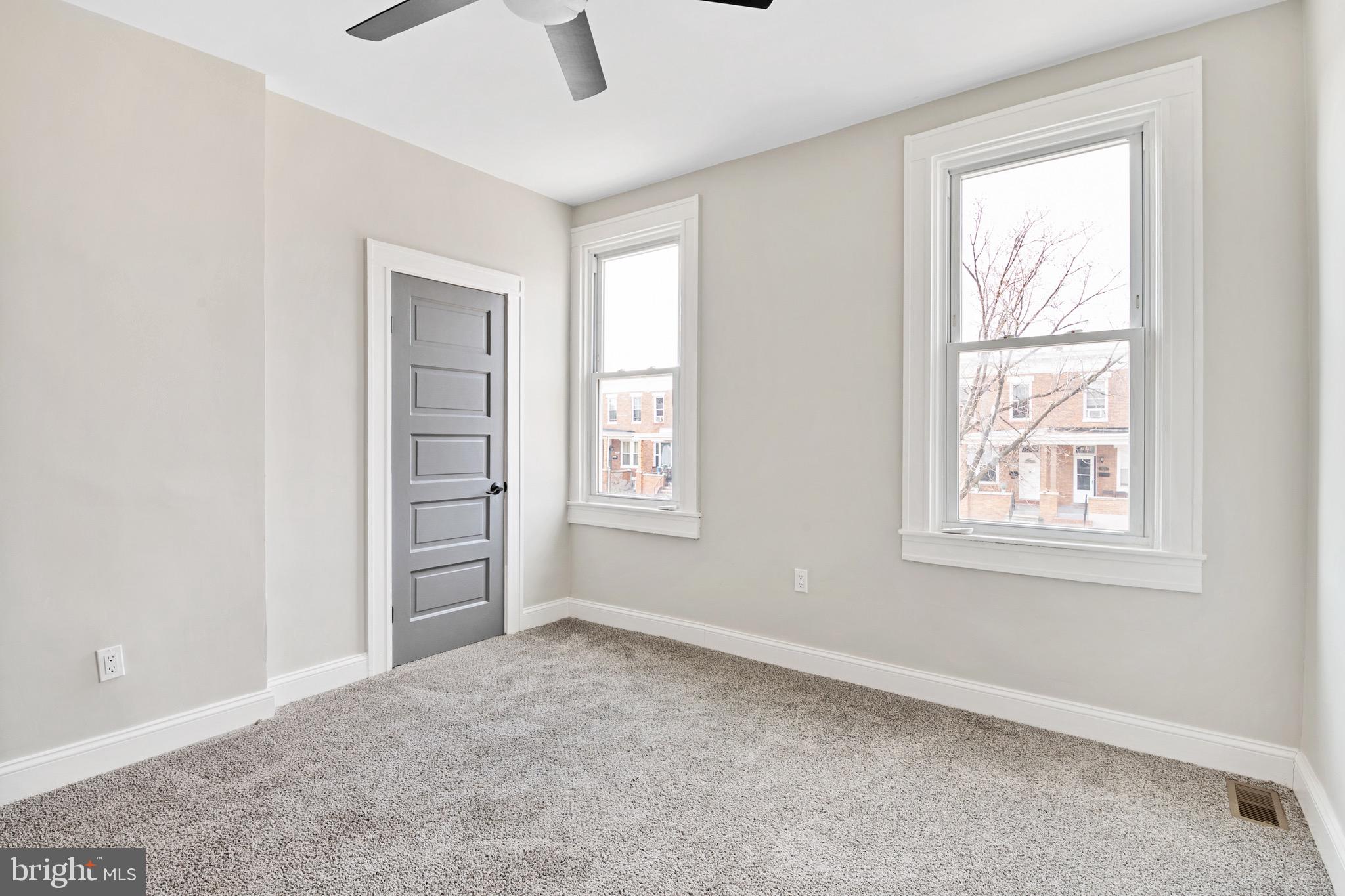2828 Lake Avenue Baltimore, MD 21213 - Photo 12 of 28 an empty room with windows and closet