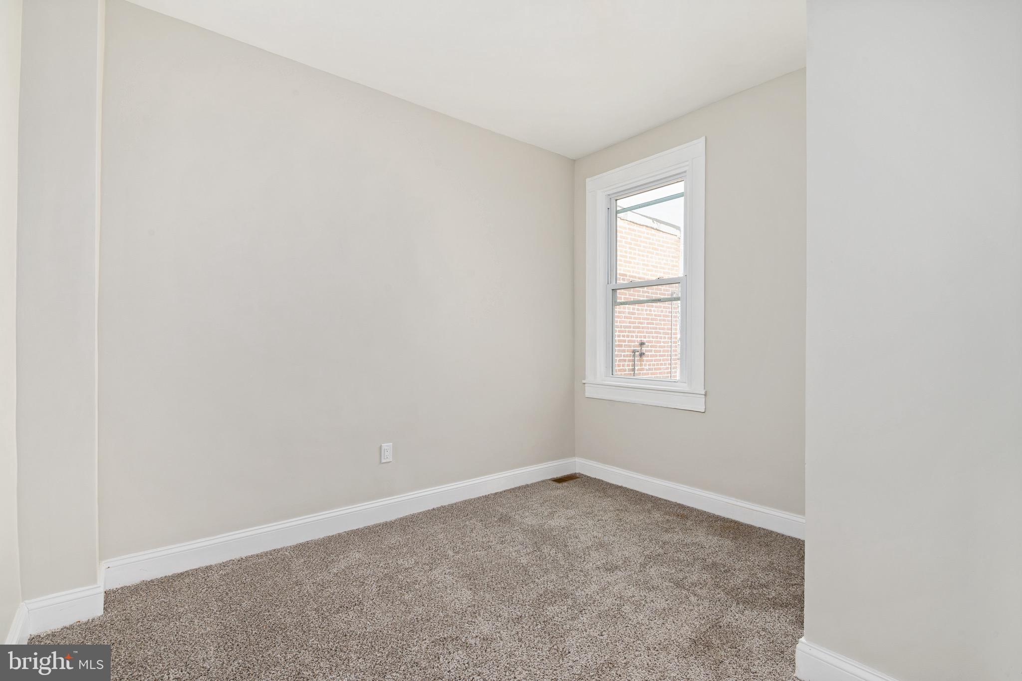 2828 Lake Avenue Baltimore, MD 21213 - Photo 16 of 28 an empty room with a window