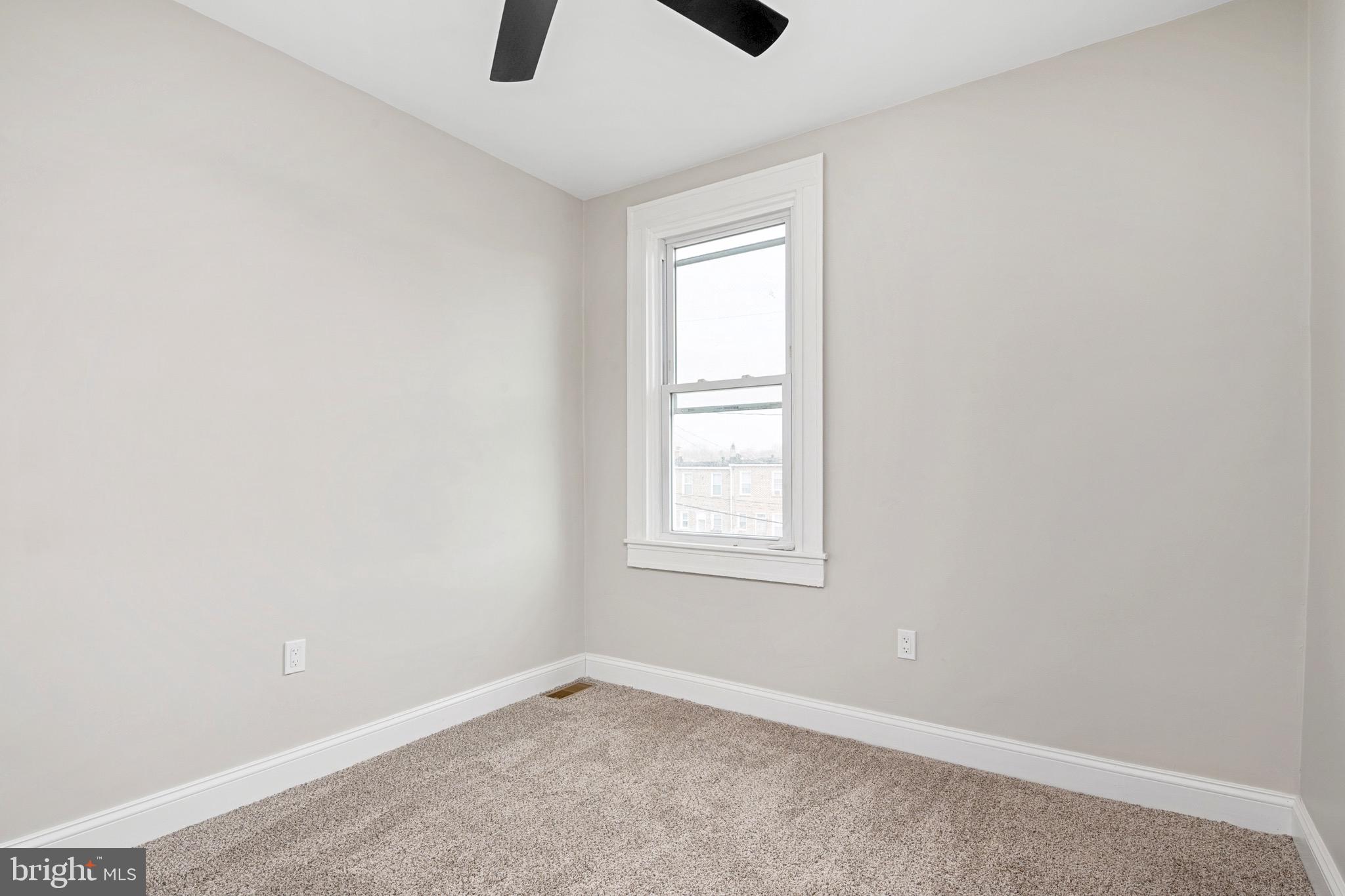 2828 Lake Avenue Baltimore, MD 21213 - Photo 18 of 28 an empty room with windows