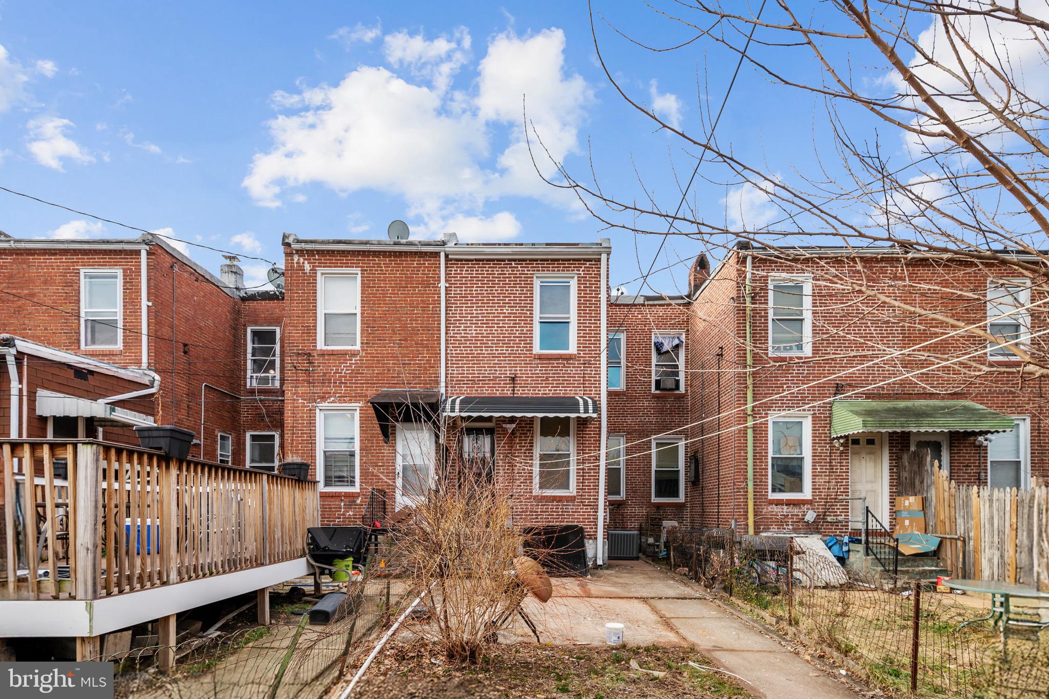 2828 Lake Avenue Baltimore, MD 21213 - Photo 24 of 28 a front view of a house with parking space