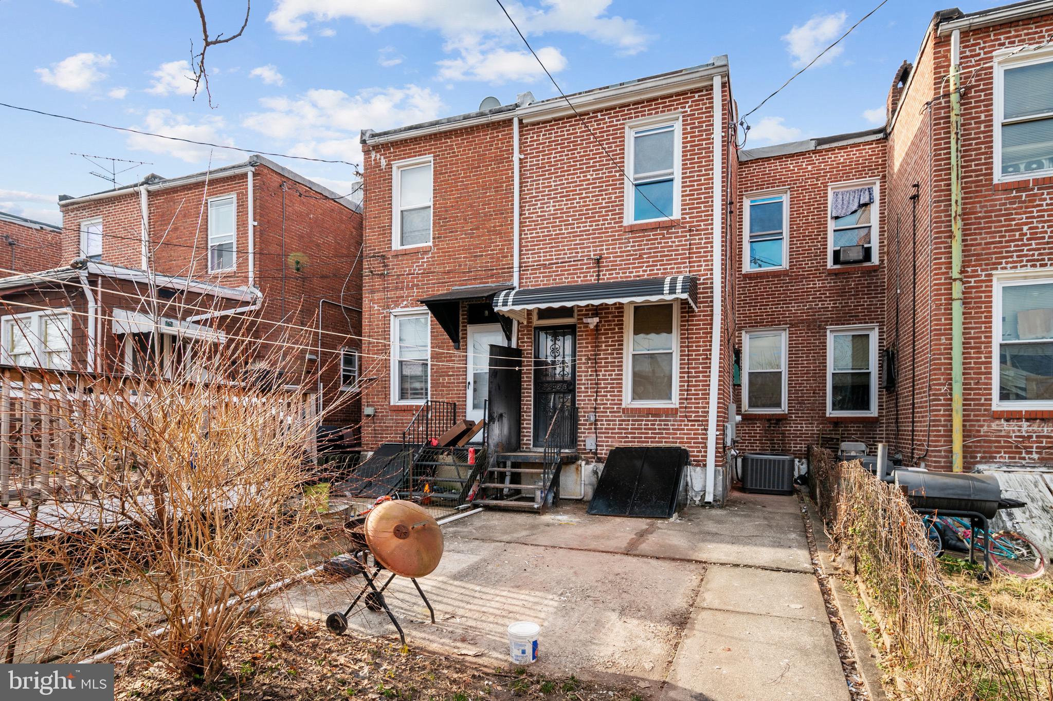 2828 Lake Avenue Baltimore, MD 21213 - Photo 25 of 28 a front view of a house with outdoor seating